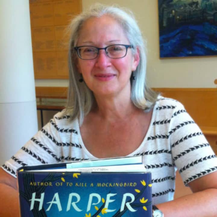 Maria Higbie, a clerk at Greenwich Library, shows off Harper Lee&#x27;s new book, &quot;Go Set a Watchman.&quot; 