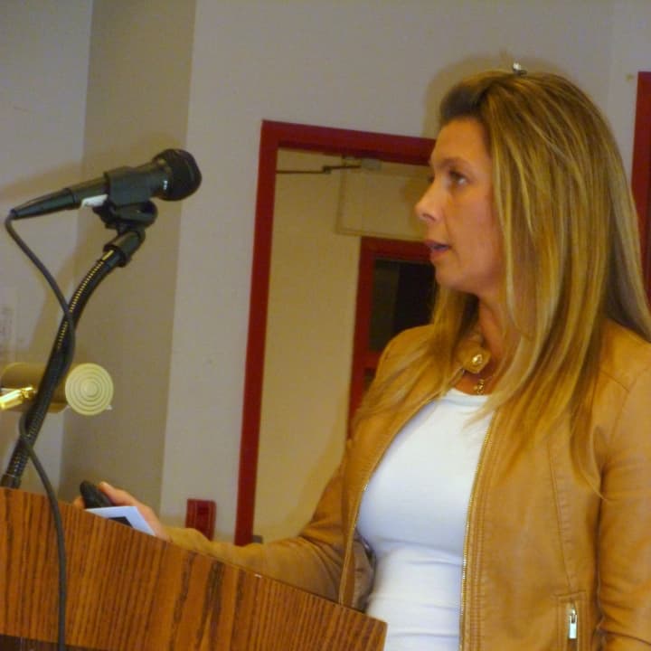 Social worker Wendy Bucaj explains the peer mediation program to the Katonah-Lewisboro School Board.