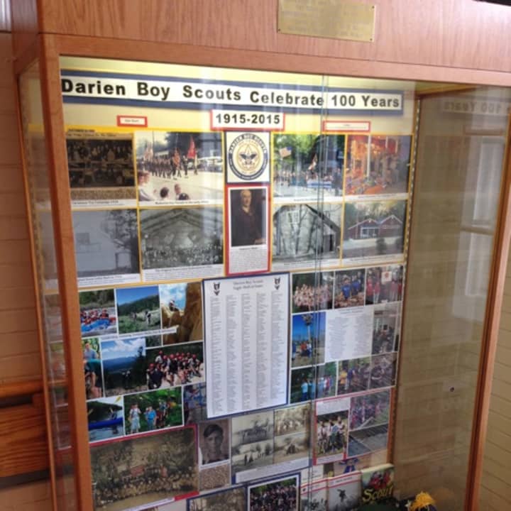 Photos and scouting materials from the Darien Boy Scouts are on display at Town Hall.