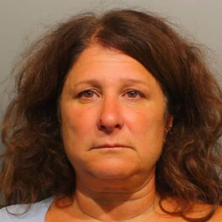 Laura M. Garbuz, 50, of 45 Breeds Hill Place, Wilton, was arrested Monday on a warrant.