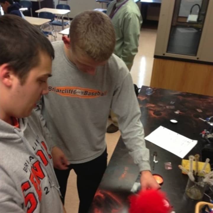 Briarcliff Manor High School students Dan Levine and Joel Haeling use fingerprint powder in Robert Saar&#x27;s class. The program is one of many made possible through the Briarcliff Manor Education Foundation.