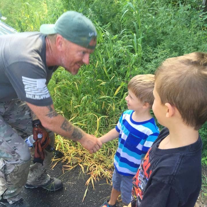 Neil Davis meets some young supporters as he makes his way to Danbury on his coast-to-coast trek to spotlight the needs of veterans. 