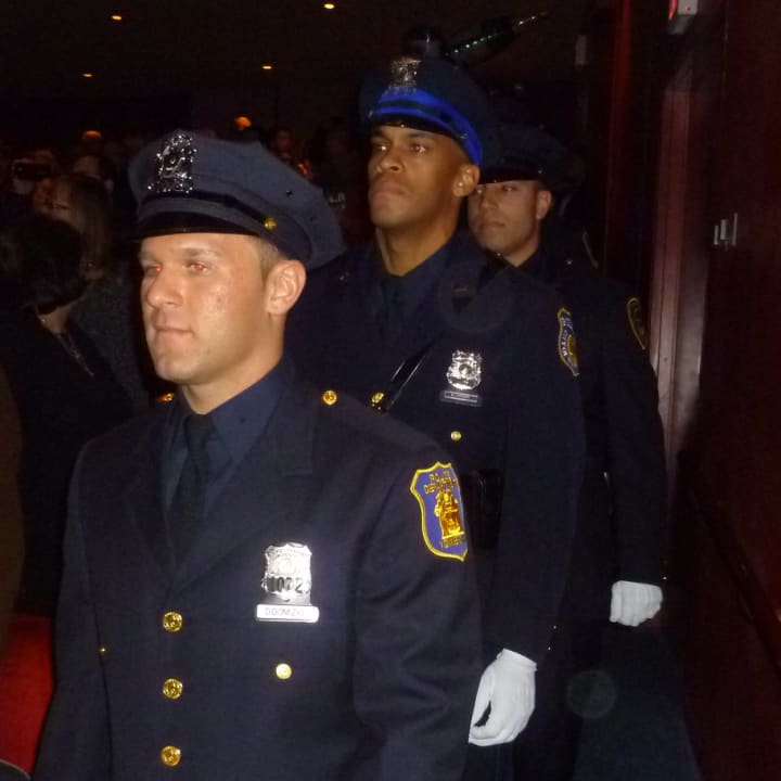 Graduates of the Westchester County Police Academy file into their ceremony on Friday.