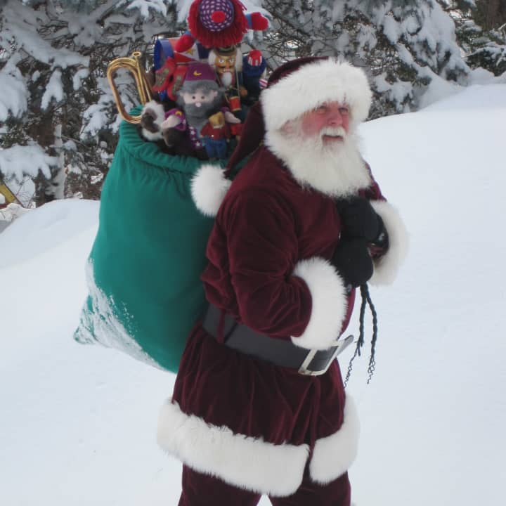 Bill Dexter, as Santa Claus, is a  volunteer with Connecticut Hospice Inc.