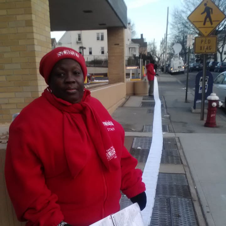 Deidre Darden-Vidro of the New York State Nurses Association holds a protest of assignment papers in front of the Mount Vernon Hospital on Wednesday morning.