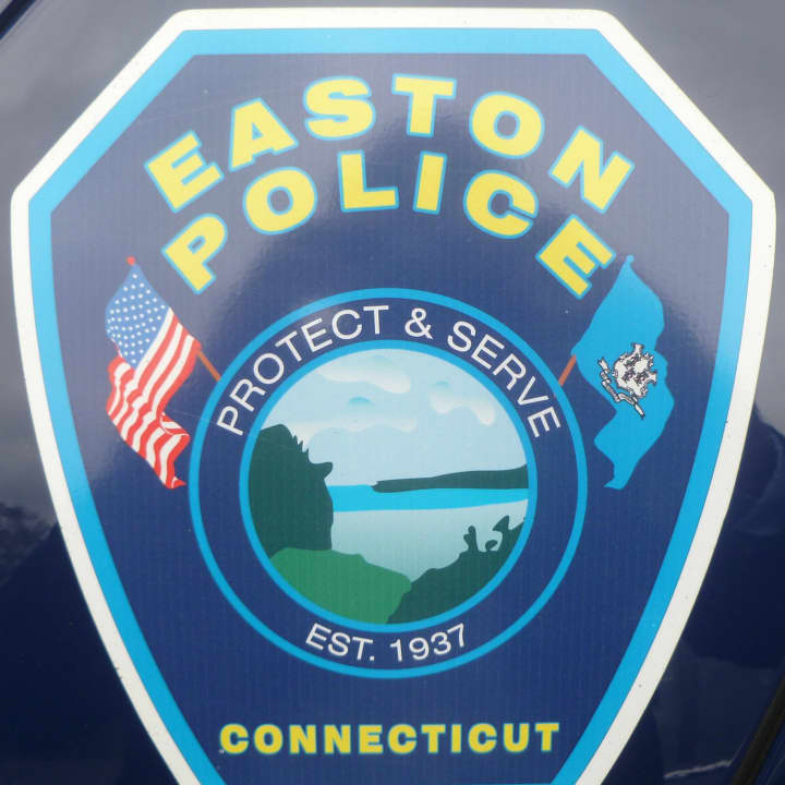 Easton police have arrested a man on two warrants for harassment and violating a protective order.