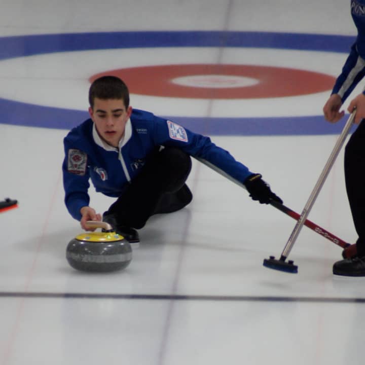 Briarcliff Manor teenager Andrew Stopera throws the rock at the 2013 USA Curling Junior National Championship.