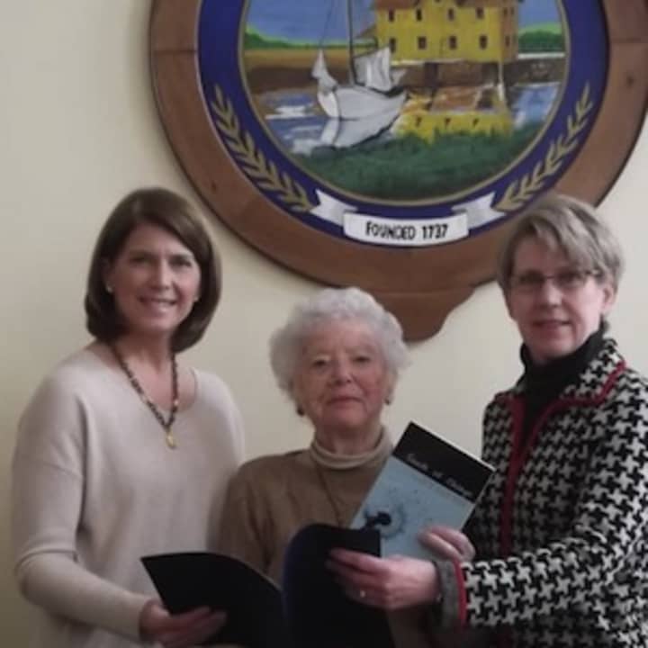 First Selectman Jayme Stevenson presents her proclamation to Darien League of Women Voters member Joan Davis and League President Gwen Mogenson.