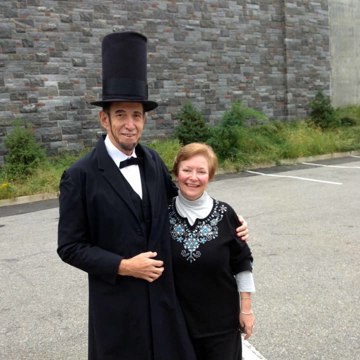 Catherine Pisani, a new member of the Lincoln Depot Foundation board of directors, with Abraham Lincoln, or at least a darn good likeness.