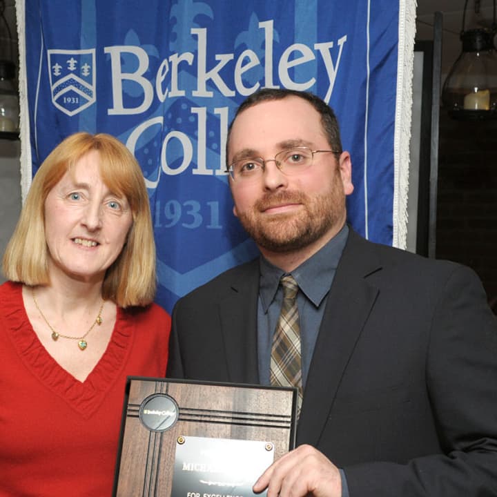 Marianne Vakalis, interim provost of Berkeley College, with Dr. Michael Jacobs, of White Plains, recipient of the Faculty of the Year Award.