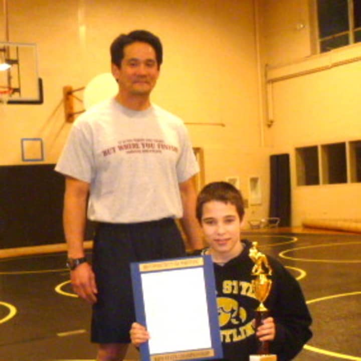 Easton&#x27;s Carson LiCastri won the Connecticut Kids State Wrestling Championship in his weight division. He is pictured with coach Michael Matsuoka.