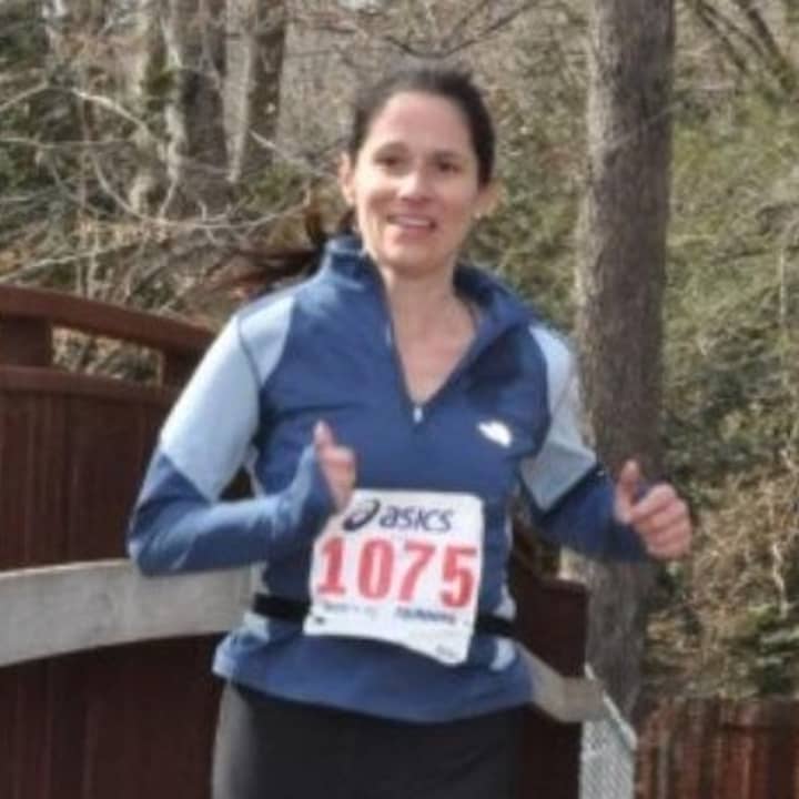 Briarcliff runner Benedicte Uguen, seen here at a prep race in Connecticut, finished the Boston Marathon about 45 minutes before two explosions ended the race.