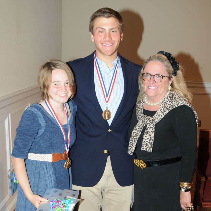 Bronxville High School sophomores Emma Watters and Steven Ircha pose with Bronxville Mayor Mary Marvin.