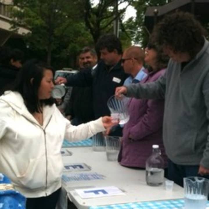 Emi Foraro samples water from nine municipal water suppliers during the 2012 blind taste test in White Plains. 