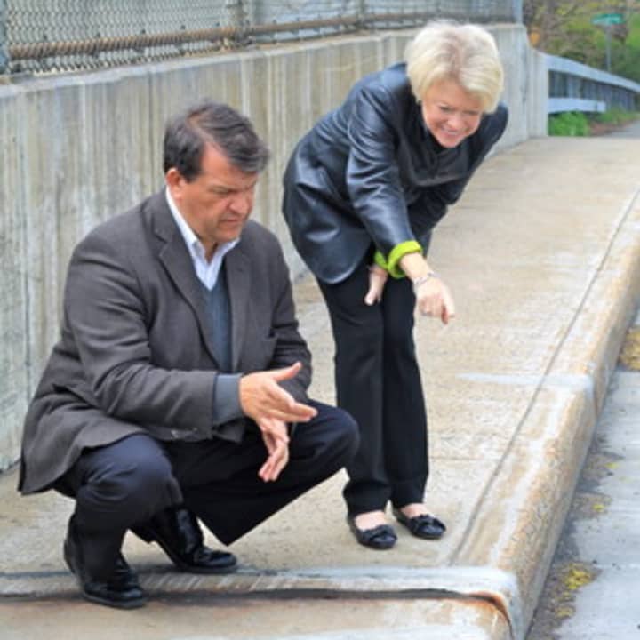 State Senator George Latimer and County Legislator Judy Myers survey the Weaver Street Bridge deck.