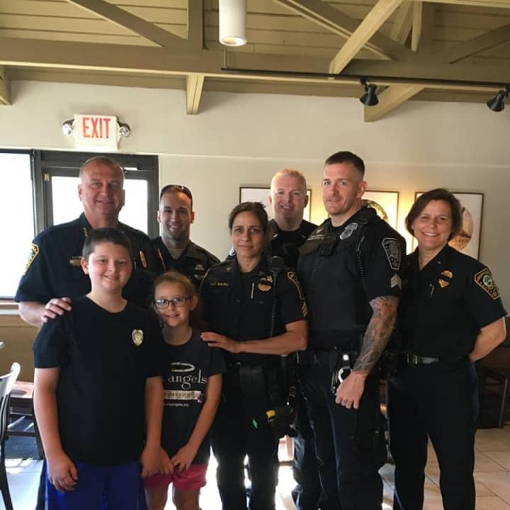 Charlie and Olivia Rabin with Norwalk Police at Coffee with a Cop.