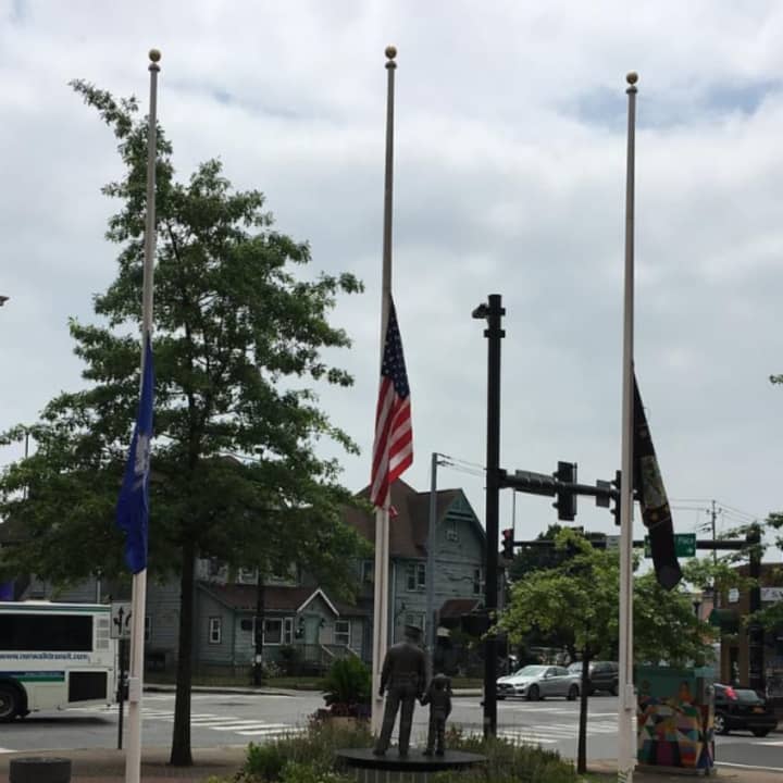 The flags are half-staff at the Norwalk Police Department.