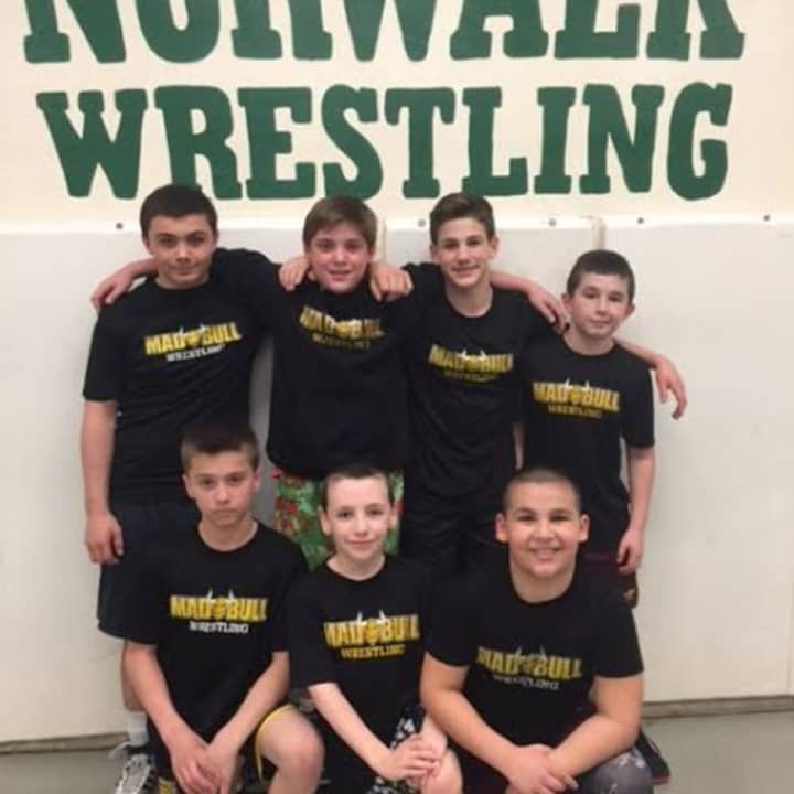 Norwalk Mad Bulls wrestlers standing are (left to right) Jeff Cocchia, Nick Augeri, Dean Tsiranides, and Nick Fatone. Kneeling left to right: Mike Bartush, Mikey Schneider and Jason Singer