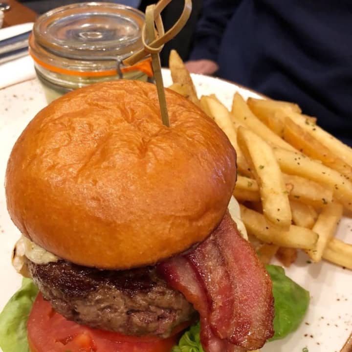 Grass-fed beef burger with french raclette cheese, gem lettuce, tomato, salt and vinegar fries and house-made pickles from Rustic Root in Woodbury (7927 Jericho Turnpike)