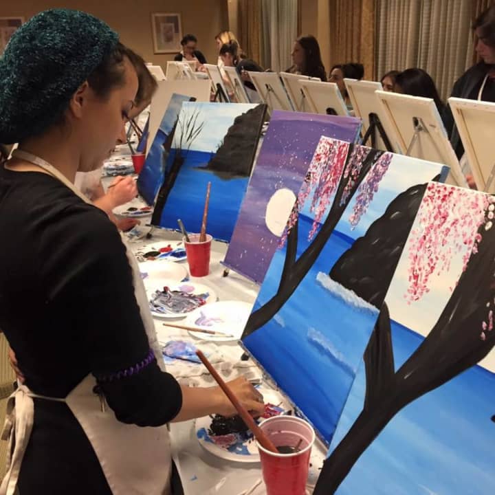 A Paint With Me student works on a painting. Paint With Me will have a session at Gotham Burger Buffet in Teaneck on Tuesday July 19.