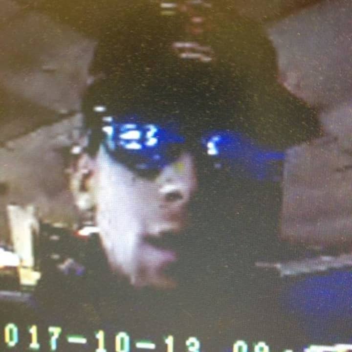 Surveillance footage of one of the suspects in an armed robbery at a Norwalk gas station on Friday