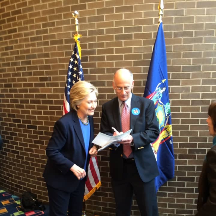 Minutes before Hillary Clinton&#x27;s speech, Greenburgh Town Supervisor Paul Feiner, right, casts an absentee ballot for the April 19 New York Democratic presidential primary Thursday at Purchase College. Clinton of Chappaqua was pleased by his choice.