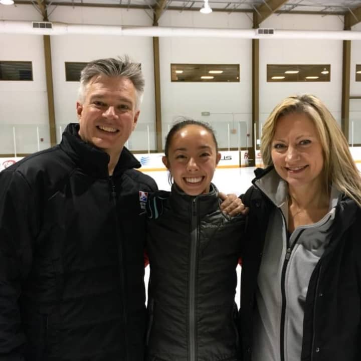 Brooklee Han, center, moved from Redding to train with coaches Peter and Darlene Cain in Texas. Han competes for Australia.