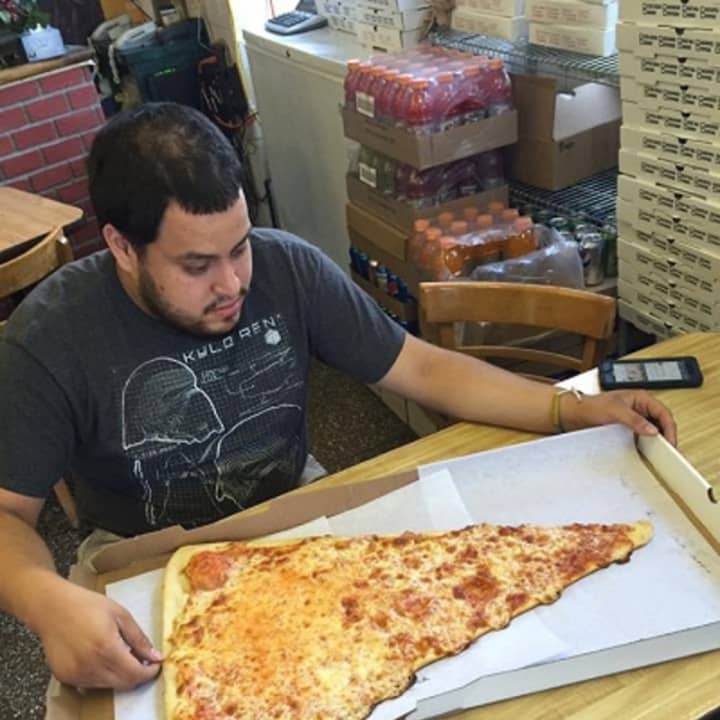 The 2-foot-long &quot;super slice&quot; has &#x27;em flocking to the Pizza Barn in Yonkers.