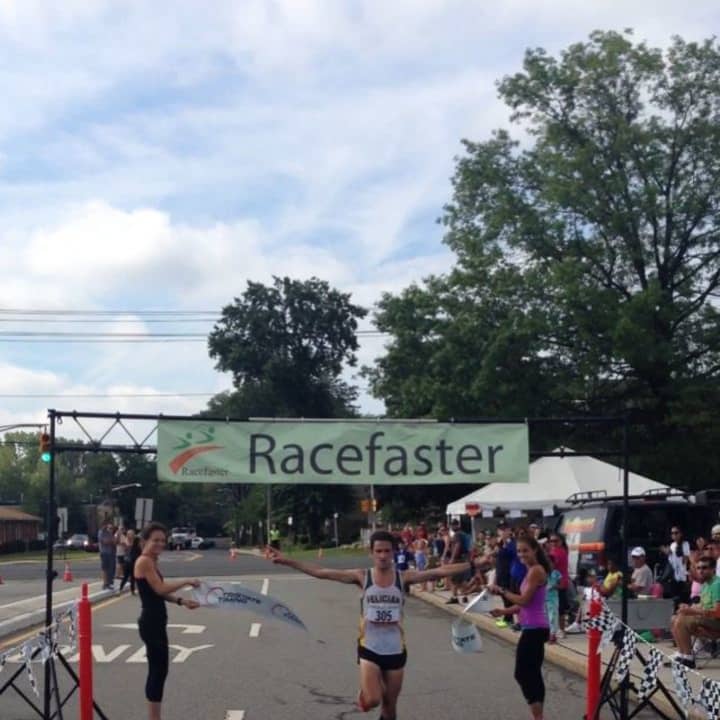A runner races through the finish line at a recent Racefaster event.