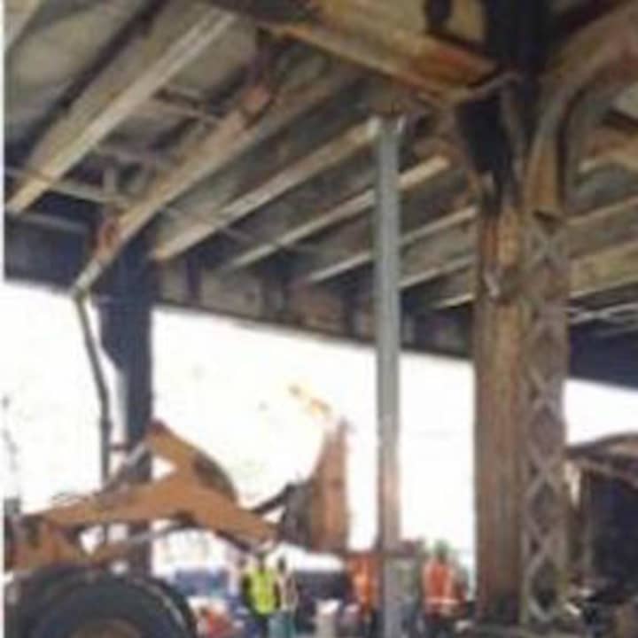 Metro-North crews work Wednesday to repair damage to the Viaduct after a fire Tuesday.