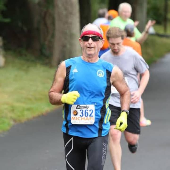 Michael Rubinfeld of Dobbs Ferry, running in a race in September, will run the New York City Marathon on Sunday. He is also fighting prostate cancer. He works at Burke Rehabilitation in White Plains.