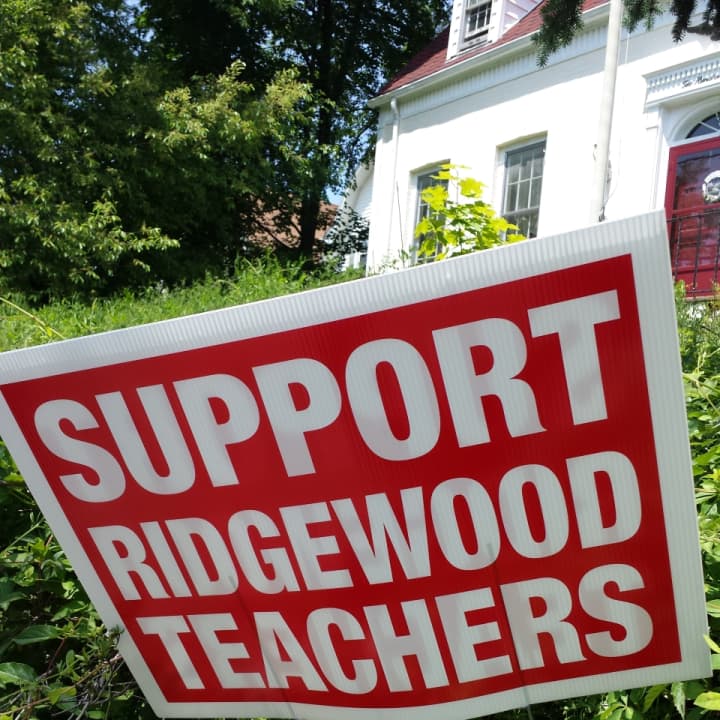 Signs in support of Ridgewood teachers have been cropping up all over the village.