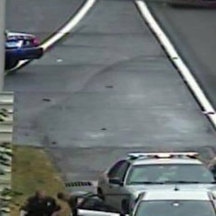 Connecticut State Police and a Norwalk police officer help deliver a baby at Exit 16 on I-95 south Thursday morning.