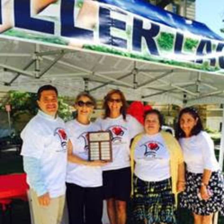 Shopper of the Year award winner Chris Bisceglia of Port Chester, N.Y., with SFS Program Director Elyse Brown, JFS of Greenwich Executive Director Lisa-Loraine Smith, and SFS shoppers Maria Roman and Odette Mouakad, in front of the Senior Center.