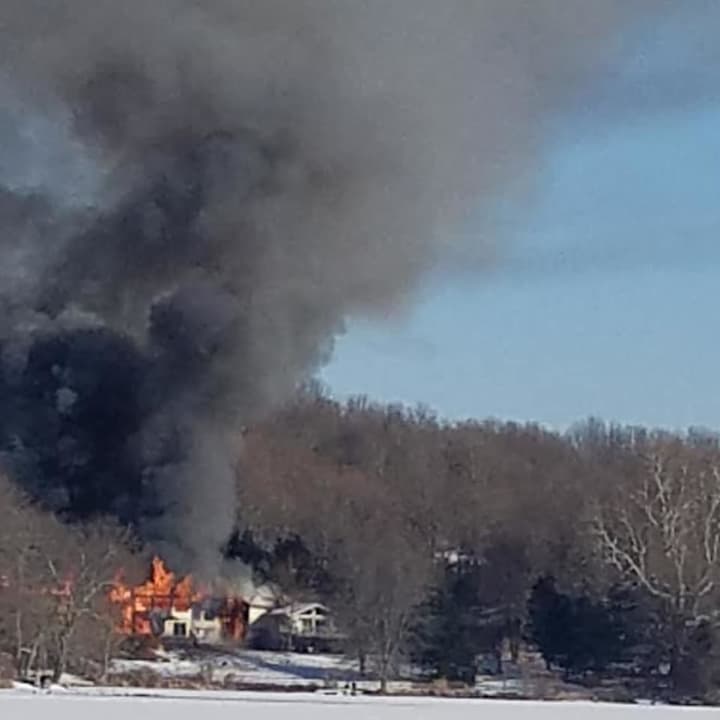 Firefighters are battling a three-alarm fire in Clinton Corners.