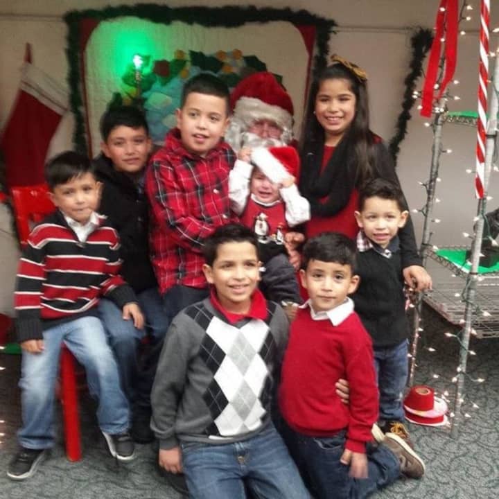 Children celebrating the holiday pop-up shop with Santa (Habitat CEO Jim Killoran) in New Rochelle. 