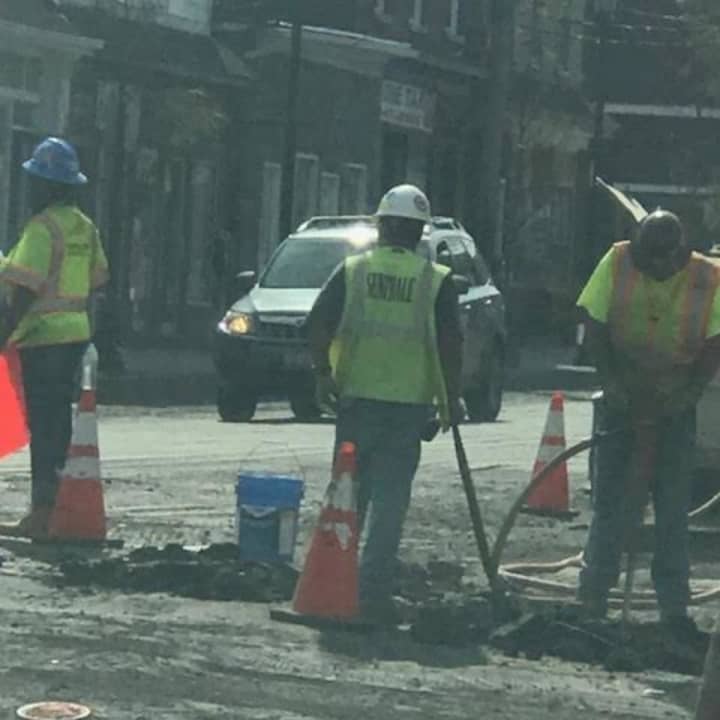 Workers in the area of Broadway and Lincoln Street.