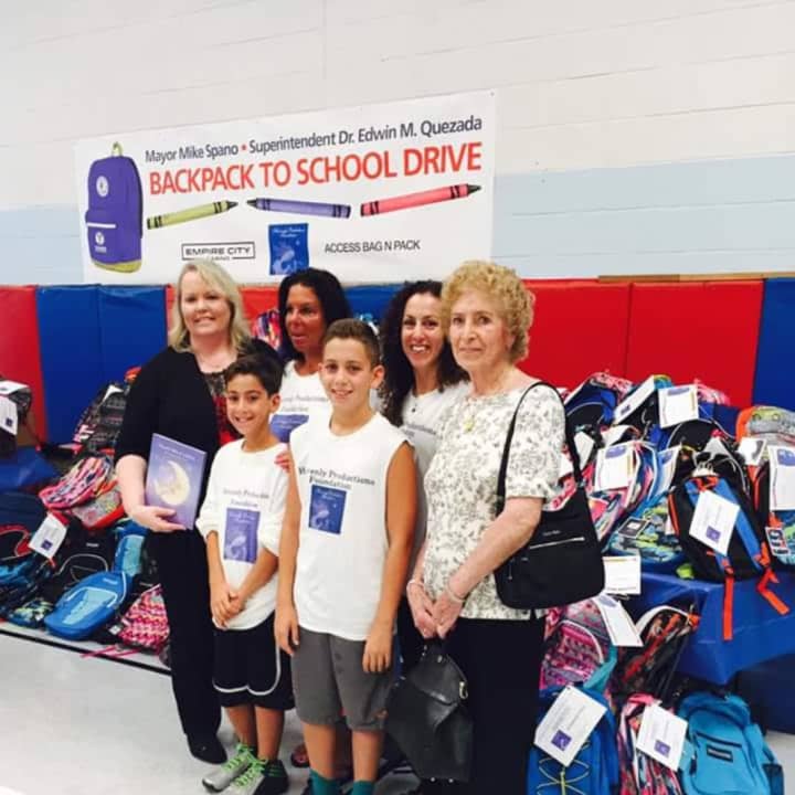 Heavenly Productions, an Armonk-based nonprofit, donated hundreds of backpacks to needy Yonkers schoolchildren. From left at P.S. 13, are: Dr. Kathy Reilly Fallon, Sheryl Nolletti, Matthew Kalian, Christian Kalian, Michelle Kalian and Anne Reilly.