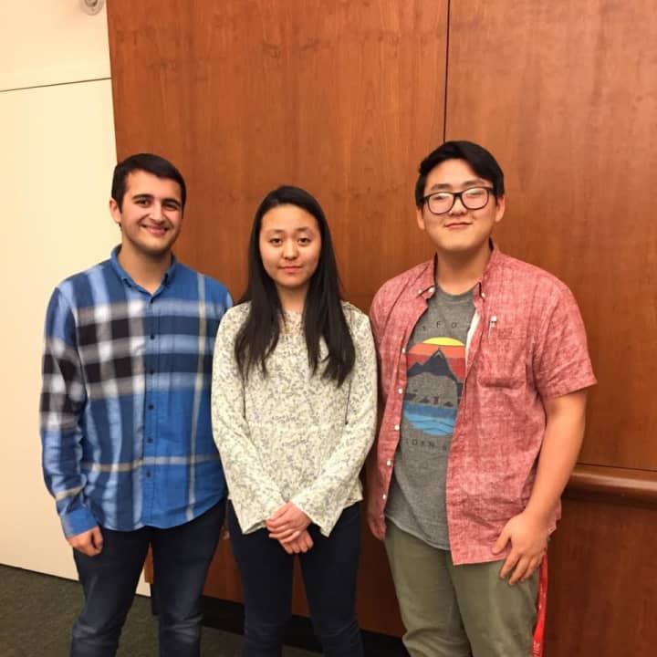 Pelham Memorial High School junior Emily Xue, middle, won first place in the sixth annual Brain Bee competition held Wednesday, Feb. 1, at Burke Rehabilitation Hospital in White Plains.