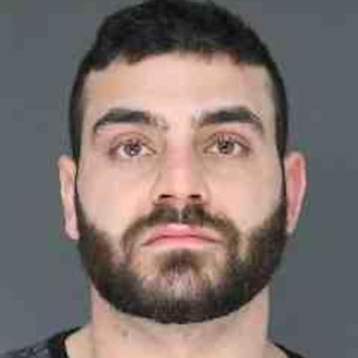 Kevork Manougian of Congers was charged with pointing a loaded AR-15 assault rifle at another man.