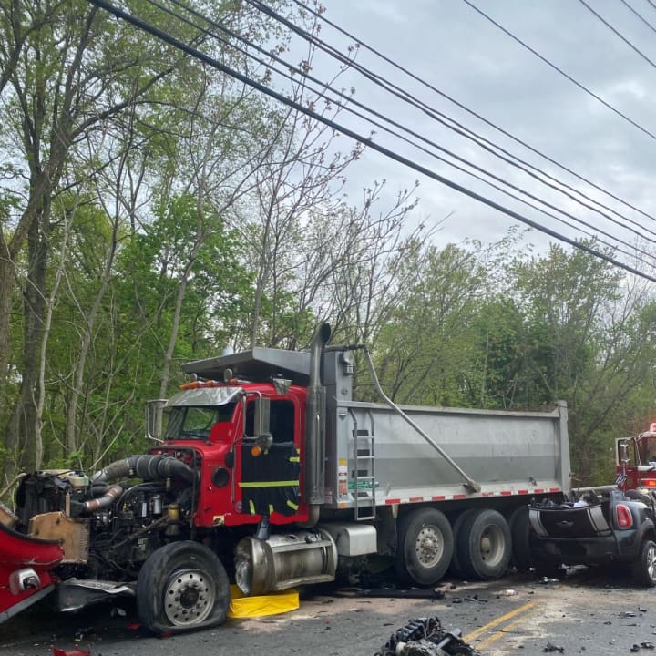 Several roads are closed in West Nyack following a crash between a car and a dump truck.