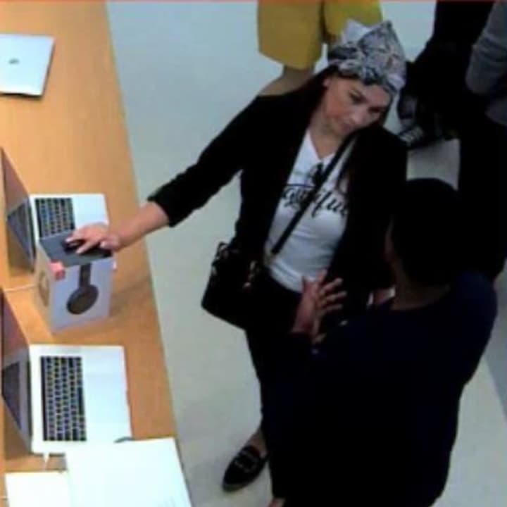 A woman is wanted by police investigators in Suffolk County after allegedly using a stolen credit card to purchase an Apple laptop.