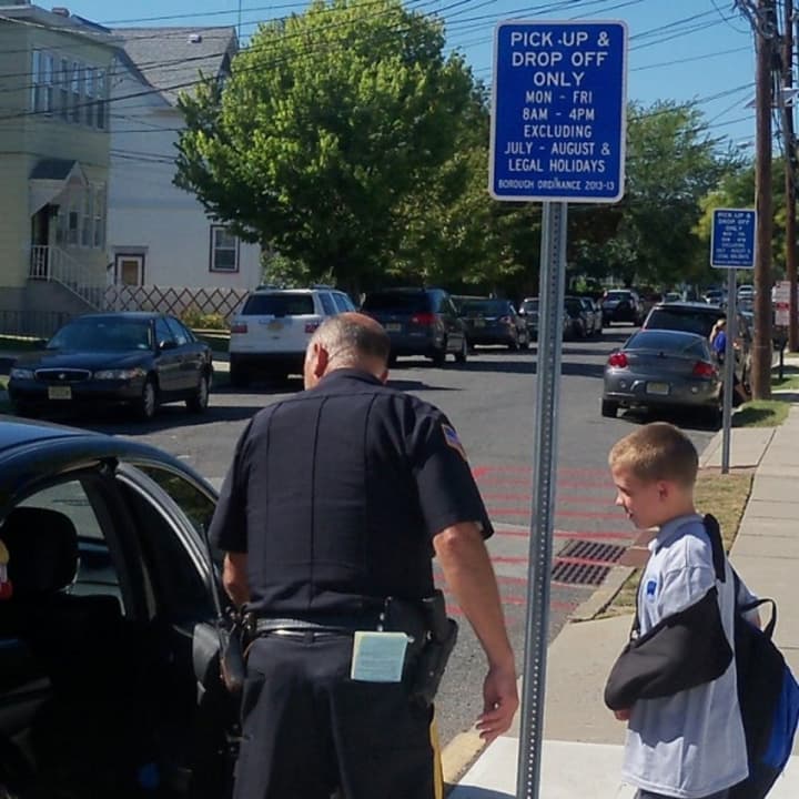 Wallington Police Officer Gerald LaVacca helps a youngster.