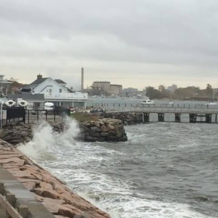 Waves are crashing at the shore at Black Rock Yacht Club in Bridgeport on Wednesday morning as a storm brews.