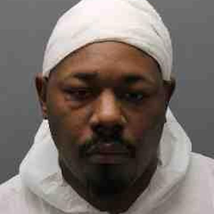 Karmel Mills, 40, pleaded not guilty to strangling his neighbor to death in Yonkers.