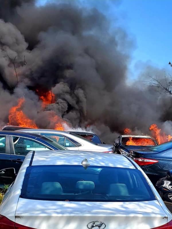 Dozens Of Cars Destroyed As Fire Spreads To Hotel Parking Lot On Long Island
