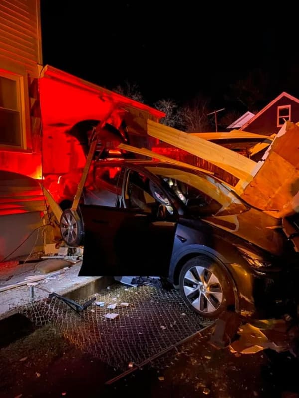 Vehicle Crashes Through Trumbull Garage, Then Hits Neighboring Home