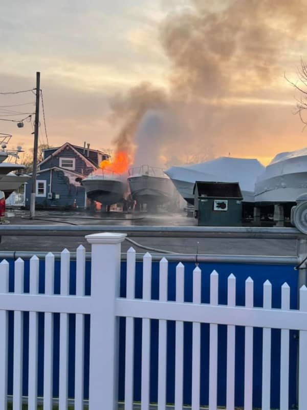 Multiple Agencies Race To Scene After Boat Near House Bursts Into Flames On Long Island