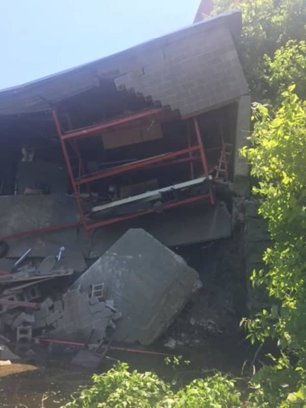 Section Of Building Collapses, Falls Into River In Shelton