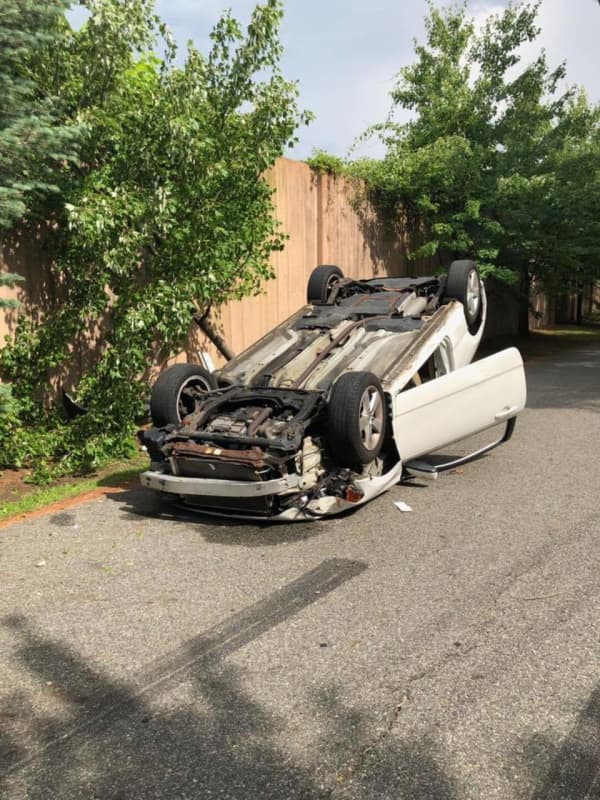 Car Overturns After Woman Tries To Pick Up Phone In Area, Police Say